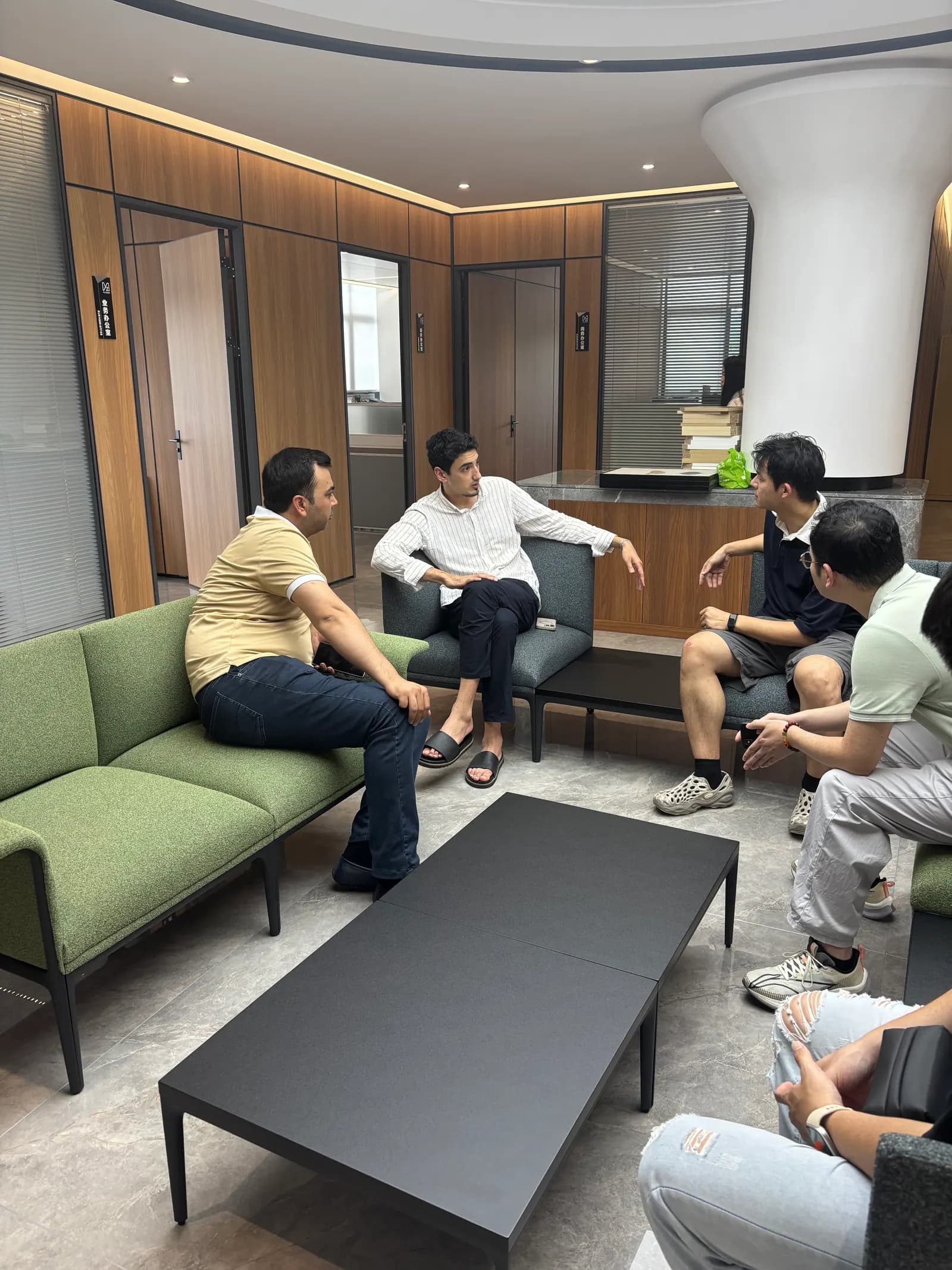 Yuzhen team discussing a school furniture project with a customer Yuzhen team discussing a school furniture project with a customer